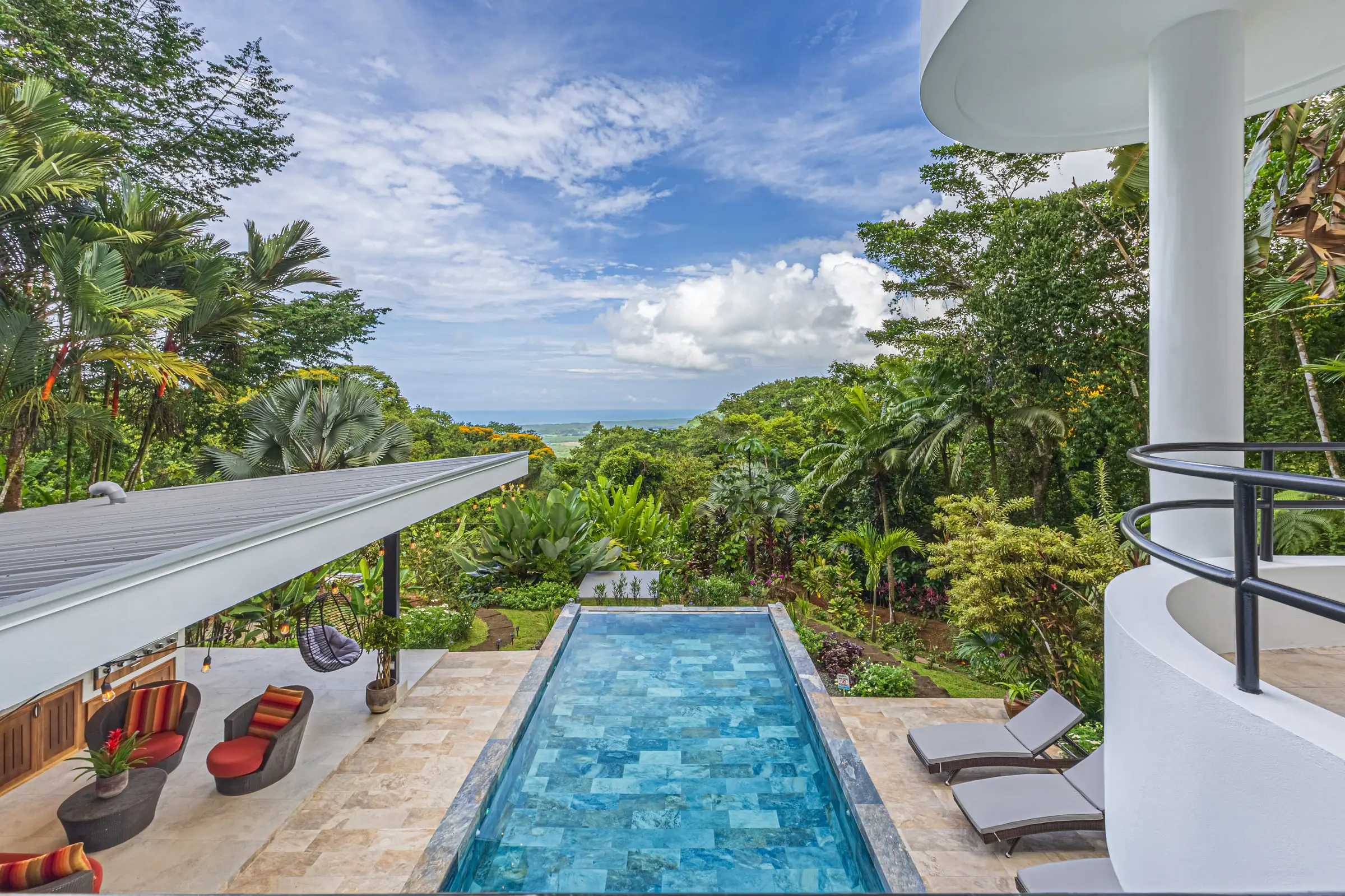 The infinity pool looking out over the treetops toward the coast